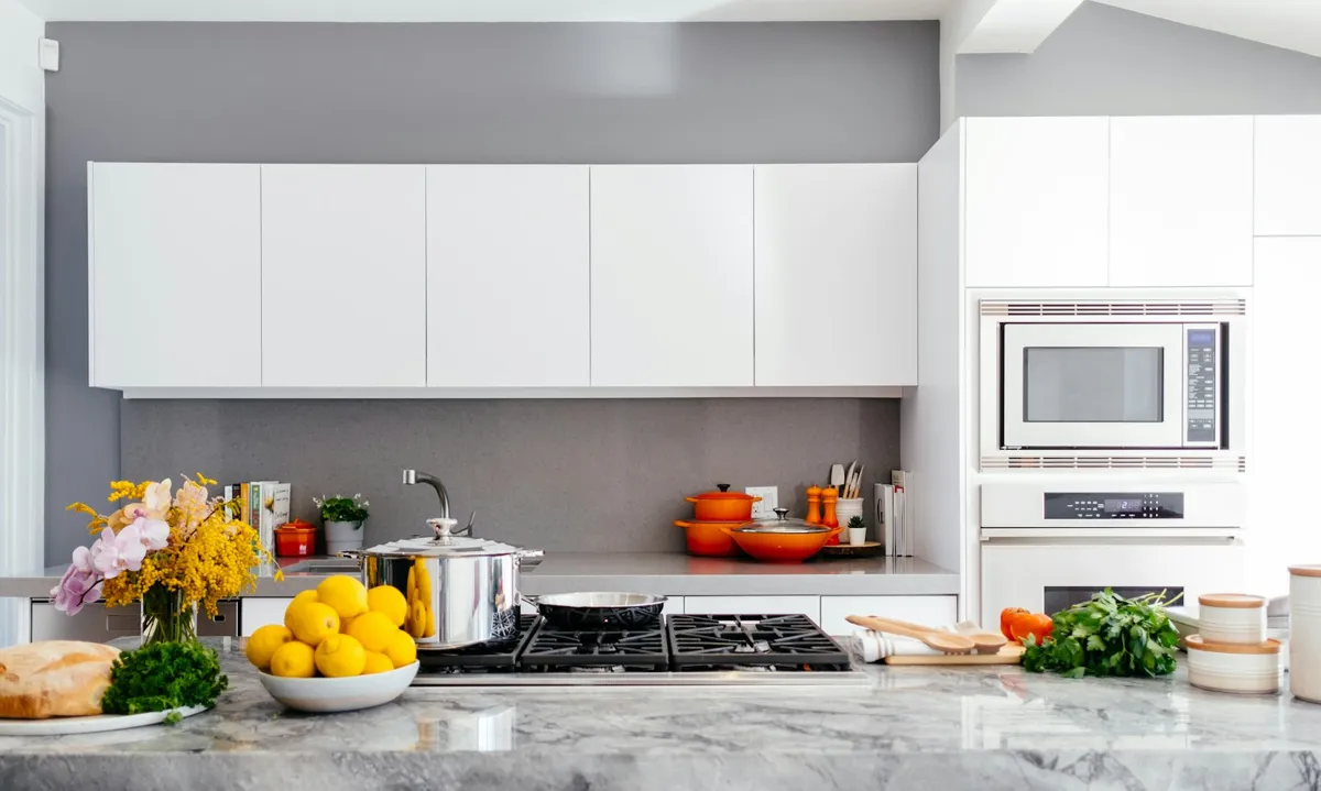 Clean kitchen counter with fresh produce in a bright home
